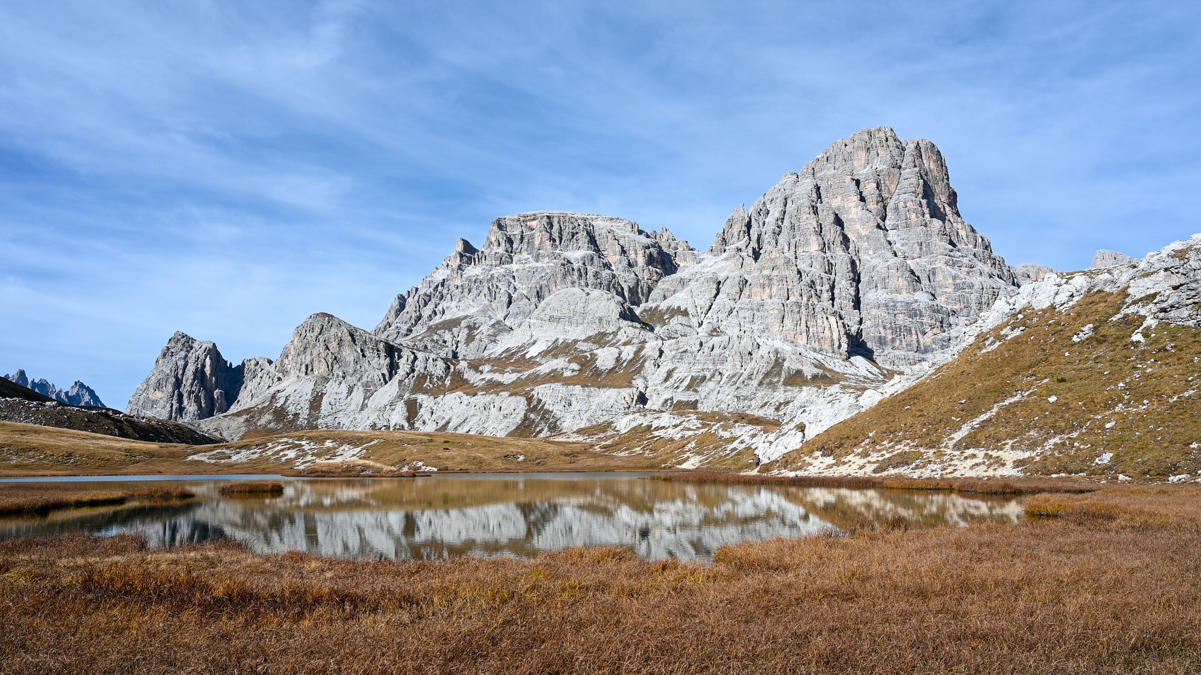 An alpine lake with mountains in the background